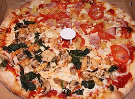 Pizza with Spinach Mushrooms Tomato Pineapple Chicken Ham